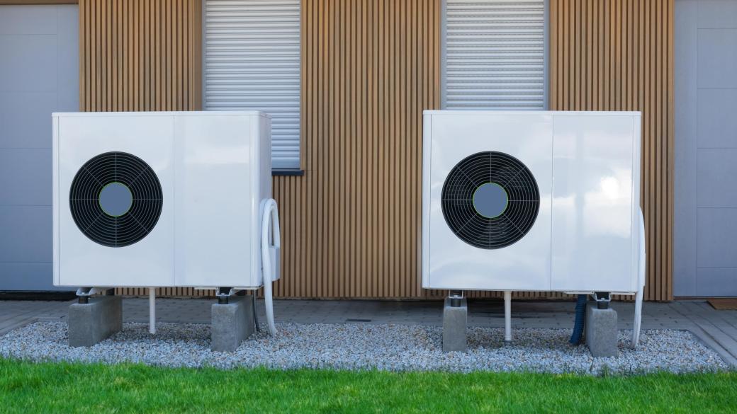 Two eco-friendly air-source heat pumps in front of a modern North Devon house.