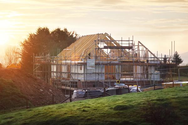 new build home under construction early morning sunrise countryside
